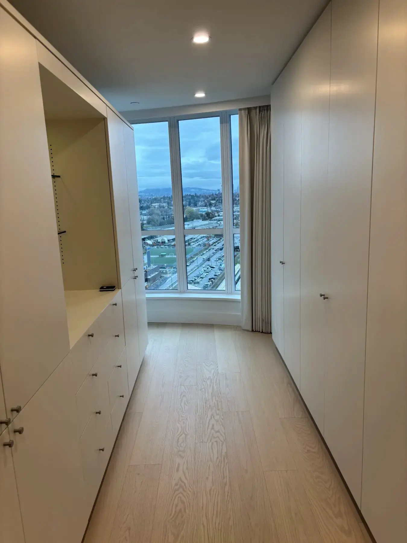 Bright organized hallway with built-ins and natural light— Housekeeping services in Vancouver