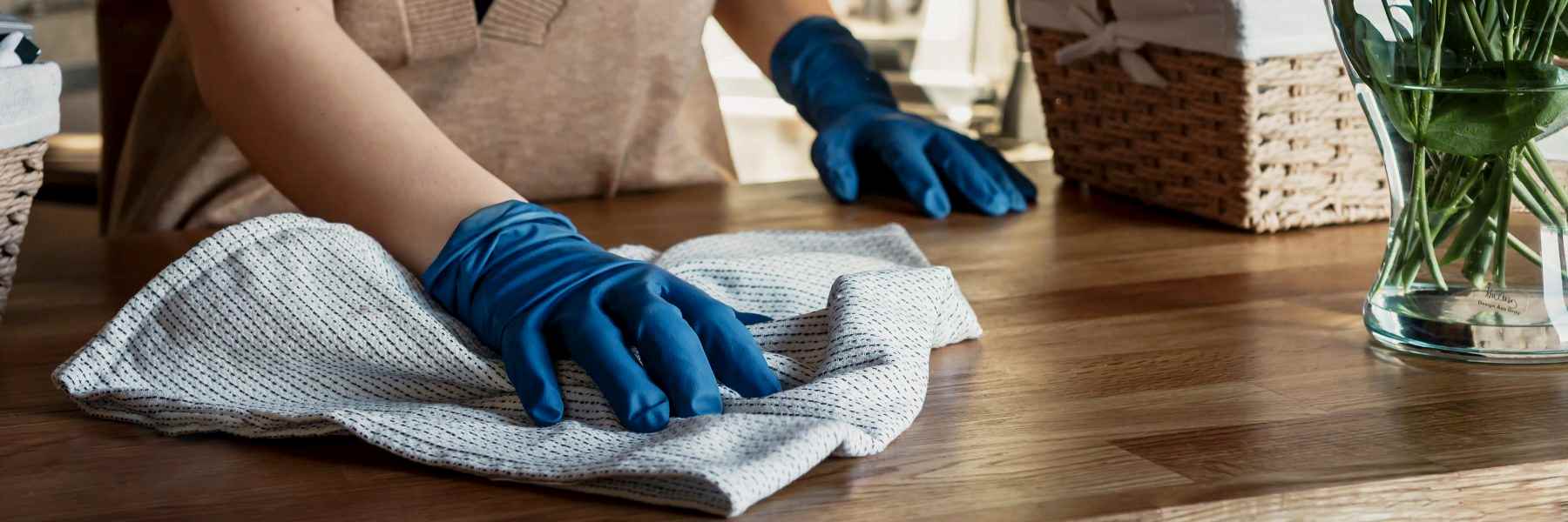 Professional house cleaning in West Vancouver, wiping and caring for surfaces