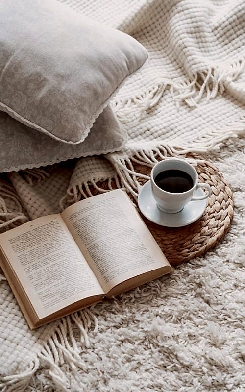 Calm coffee table scene with book and neutral textures in a bright Vancouver home.